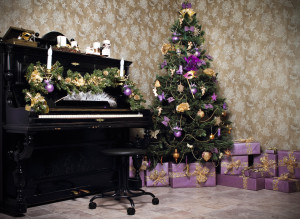 Vintage room with black piano, Christmas tree, candles, gifts  or presents and decoration