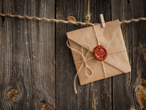 love letter with wax seal and a wooden pencil